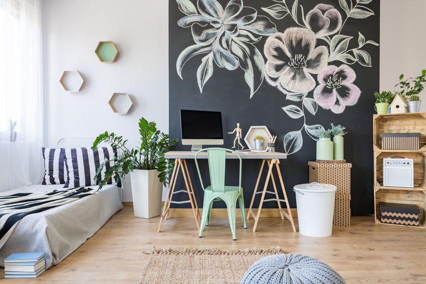 Cozy stylish bedroom with floral accent wall