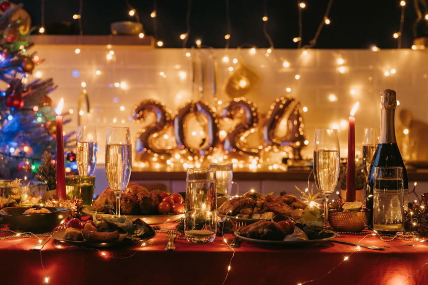 No people shot of holiday table decorated with Christmas ornaments and 2024 numbers on background